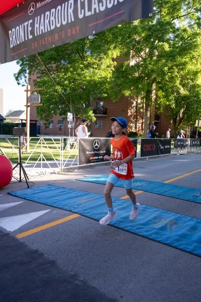 Bronte Harbour Classic 5K 2026 official race photo: Kids 1K, Bib 1, Mercedes-Benz Oakville, CIBC, Be Active Physio.
