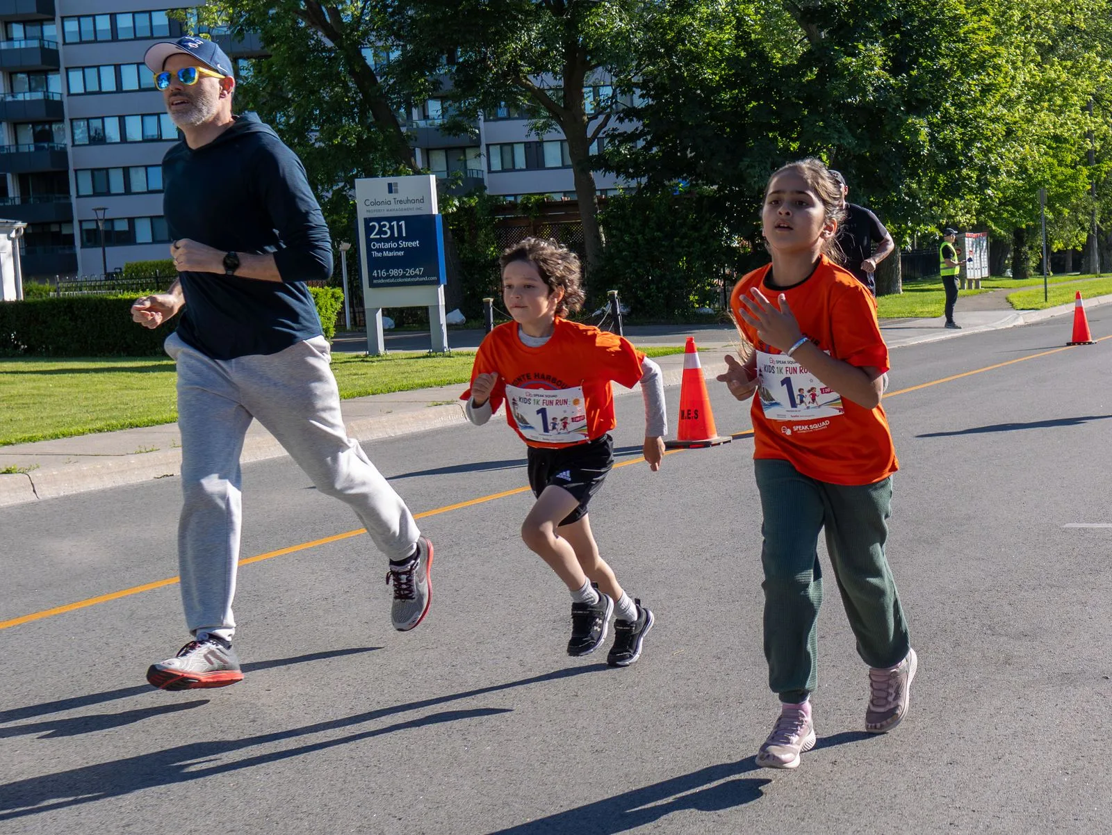 Runners training together on a road — BHC Official Training Clinic